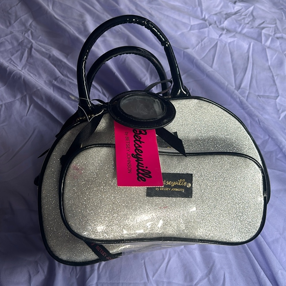 Brand new Betsey Johnson makeup/travel bag with tags